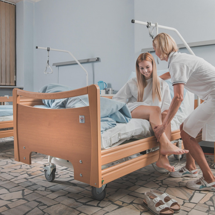 Auxiliary Nurse Assisting Patients